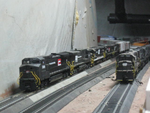 Photo of two penn central dash9's and u33b and  u28b's